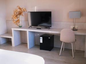 TV a/nebo společenská místnost v ubytování Hotel Plaza Las Matas