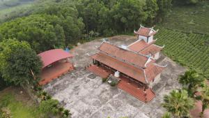 an overhead view of a building in a vineyard at Đức Tới Farmstay in Ho Tô +45 photos
