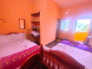 Postel nebo postele na pokoji v ubytování Pushpa Mahal A/C & Pushpa Residency