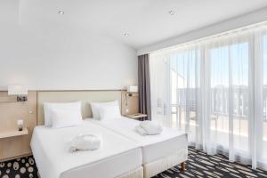 Posteľ alebo postele v izbe v ubytovaní Park Inn by Radisson Sarvar Resort & Spa - All Inclusive