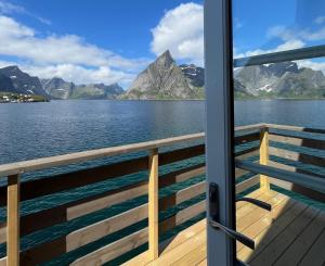 a view from the deck of a cruise ship at Toppøy Rorbuer in Reine