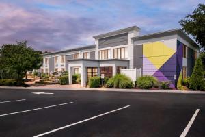 a rendering of a building with a mural at Spark By Hilton Hummelstown Hershey in Hummelstown
