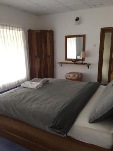 Postel nebo postele na pokoji v ubytování Camellia Mountain Villa