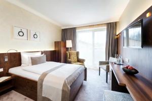 Postelja oz. postelje v sobi nastanitve Revital Resort Aspach + 37 fotografij