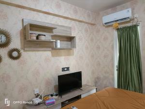 TV a/nebo společenská místnost v ubytování Room 888