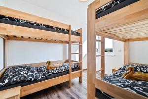 a bedroom with two bunk beds in a house at Apartmány Jakub in Příseka +20 photos