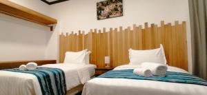 Postel nebo postele na pokoji v ubytování Mamutik Island Lodge