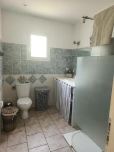 a bathroom with a toilet and a sink at Appartement PALAZZI 2 in LʼÎle-Rousse +21 photos