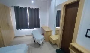 Postel nebo postele na pokoji v ubytování FabHotel Kas