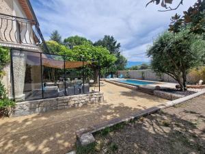 an external view of a house with a swimming pool at Nel Home in Mazan