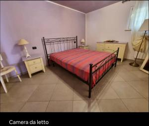 Postel nebo postele na pokoji v ubytování villetta nel verde delle Bagnese