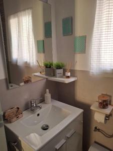 a bathroom with a sink and a mirror at El Corralillo de Victorina in San Martín de Valdeiglesias +21 photos