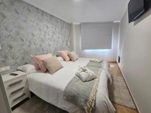 Cama o camas de una habitación en Apartamento Nara Playa