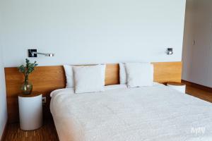 Posteľ alebo postele v izbe v ubytovaní Apartamenty Muzeum II Wojny Światowej