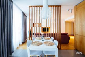 Posedenie v ubytovaní Apartamenty Muzeum II Wojny Światowej