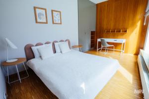 Posteľ alebo postele v izbe v ubytovaní Apartamenty Muzeum II Wojny Światowej