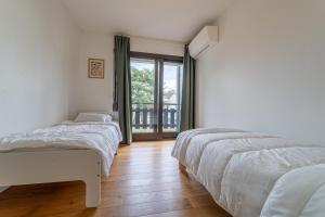 Katil atau katil-katil dalam bilik di Le Duplex - Appartement 3 Chambres à Bordeaux