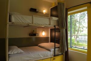 Letto o letti in una camera di Julley Commune Rishikesh