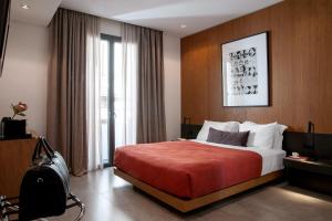 Ein Bett oder Betten in einem Zimmer der Unterkunft The Editor Hotel Athens