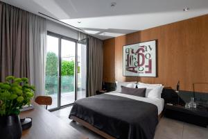 Ein Bett oder Betten in einem Zimmer der Unterkunft The Editor Hotel Athens