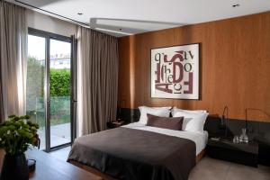 Ein Bett oder Betten in einem Zimmer der Unterkunft The Editor Hotel Athens