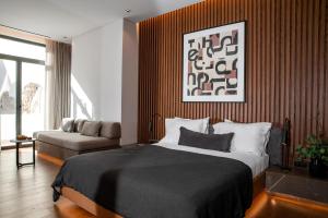 Ein Bett oder Betten in einem Zimmer der Unterkunft The Editor Hotel Athens