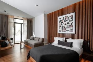 Ein Bett oder Betten in einem Zimmer der Unterkunft The Editor Hotel Athens