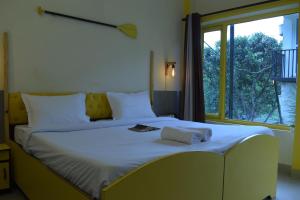 Letto o letti in una camera di Julley Commune Rishikesh