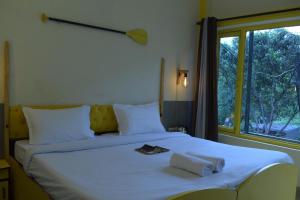 Letto o letti in una camera di Julley Commune Rishikesh