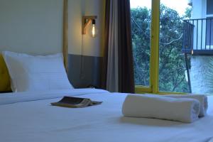 Letto o letti in una camera di Julley Commune Rishikesh
