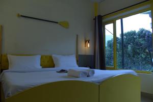 Letto o letti in una camera di Julley Commune Rishikesh