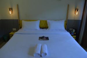 Letto o letti in una camera di Julley Commune Rishikesh