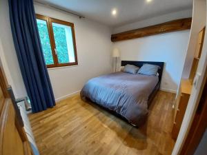 Ένα ή περισσότερα κρεβάτια σε δωμάτιο στο Le gite de Diane