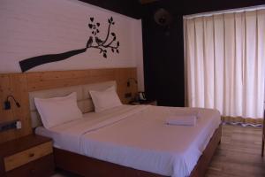 Letto o letti in una camera di Julley Commune Rishikesh