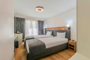 Postel nebo postele na pokoji v ubytování Silvana Hotel