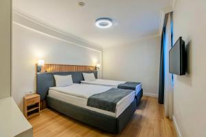 Postel nebo postele na pokoji v ubytování Silvana Hotel