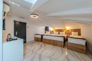 Postel nebo postele na pokoji v ubytování Silvana Hotel