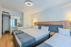 Postel nebo postele na pokoji v ubytování Silvana Hotel