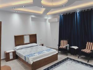 Postel nebo postele na pokoji v ubytování استديو المريوطية