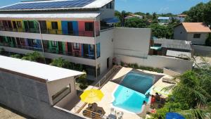 an aerial view of a building with a swimming pool at Pousada Toca do Ceará in Regencia Augusta
