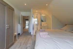 Giường trong phòng chung tại Villa Remis