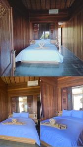 Ein Bett oder Betten in einem Zimmer der Unterkunft Putra'Lebah Amed Guest House