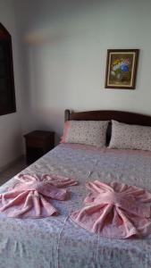 
Cama ou camas em um quarto em Pousada Atelier Aly da Costa
