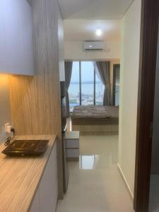 En eller flere senge i et værelse på COMFORTSTAY-Pollux Mall Batam Center TOWER B #3902 + 7 billeder