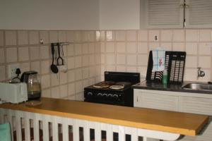 Η κουζίνα ή μικρή κουζίνα στο Driftsands uvongo +15 φωτογραφίες