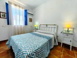 En eller flere senge i et værelse på El Oasis de Castil