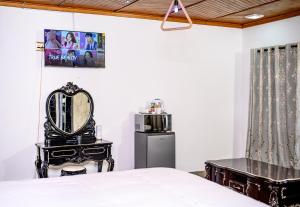 a bedroom with a bed and a mirror and a microwave at Carolina Resort in Carolina