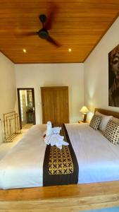Postel nebo postele na pokoji v ubytování Willow Homestay