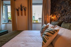 En eller flere senge i et værelse på Casa Laurinda Funchal