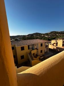 a view from a balcony of a building at Il Girasole casa vacanze in Porto San Paolo +6 photos
